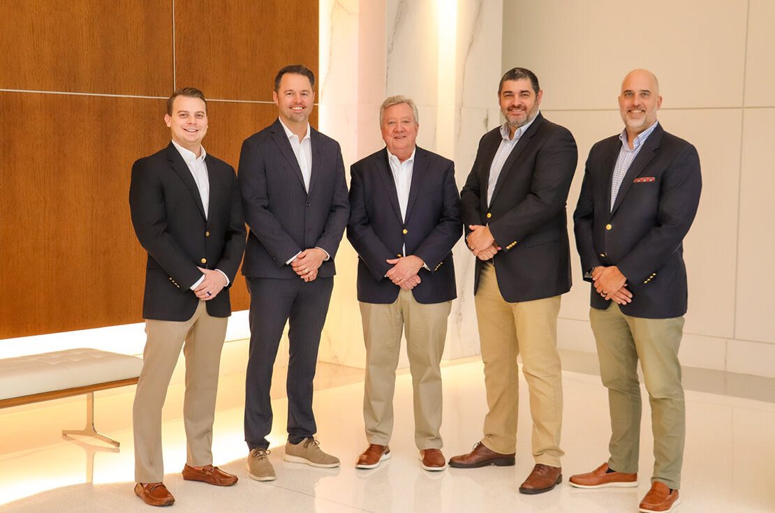 Firm partners standing together outside in business attire